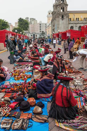 Merchants selling fabric goods. Miraflores, Lima, Peru.