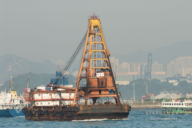 Barge in Victoria Harbor. Hong Kong, China.