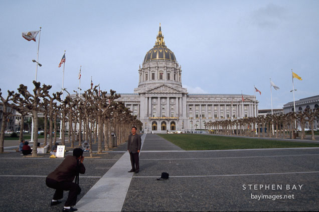Tourists taking pictures of City Hall. San Francisco, California, USA.
