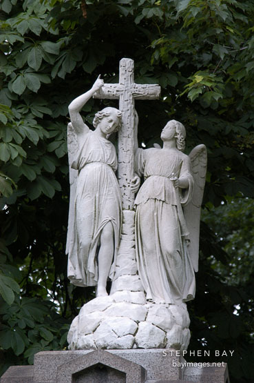 Statue of angels and cross at Lake View Cemetery. Cleveland, Ohio, USA