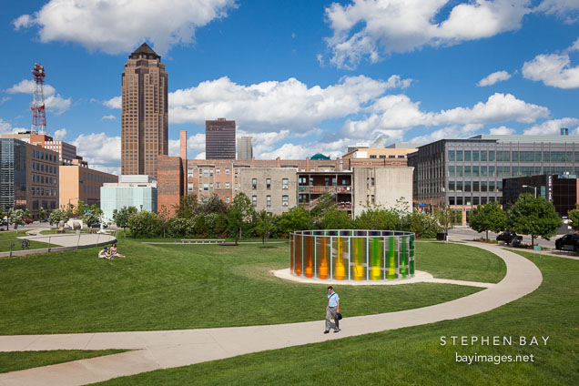 Man walking through the Pappajohn sculpture park. Des Moines, Iowa.