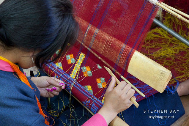 Student weaving a geometric pattern. National Institute for Zorig Chusum, Thimphu, Bhutan.