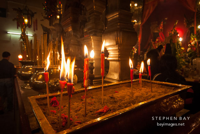 Burning candles at Man Mo Temple. Hong Kong, China.