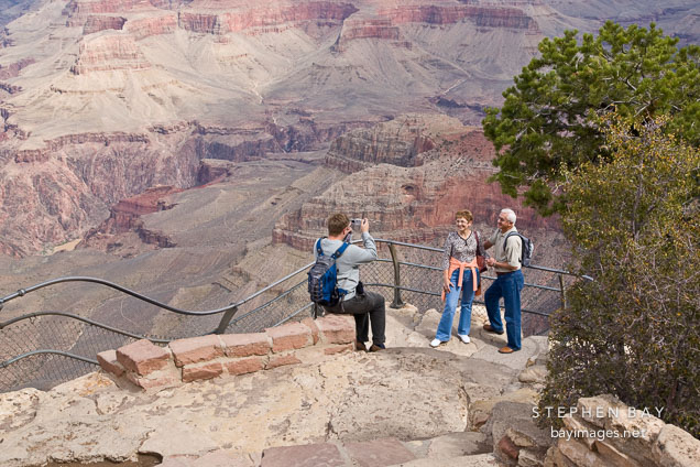 Tourists take photographs at Yavapai Pt. Grand Canyon NP, Arizona.