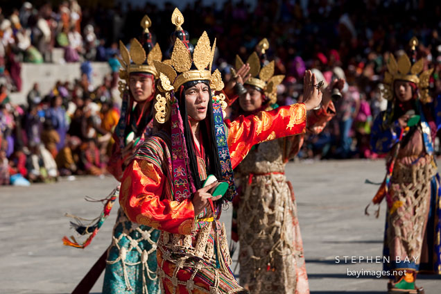 Dancer with ornate golden crown. Thimphu tsechu, Bhutan.