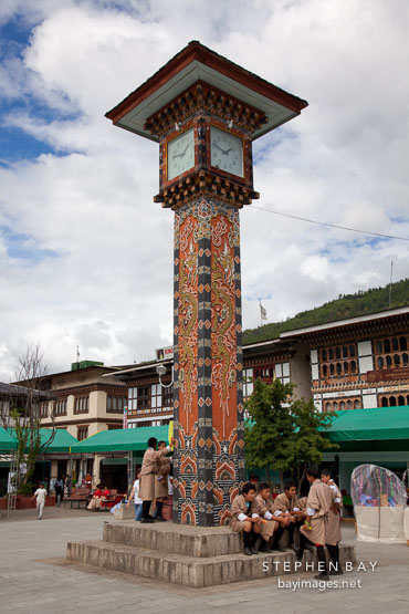 School boys by the clock tower. Thimphu, Bhutan.