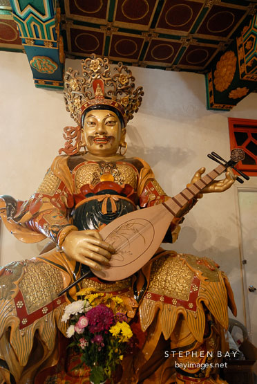 East deva-king holding a Pi-pa. Welto Temple, Po Lin Monastery.