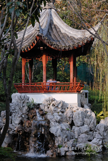 Pagoda on a pond at the Kowloon walled city park. Hong Kong.