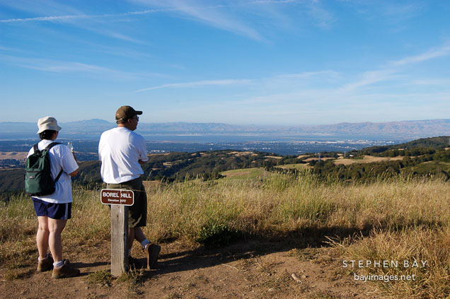 Hikers on Borel Hill. Russian Ridge Open Space Preserve. California, USA.