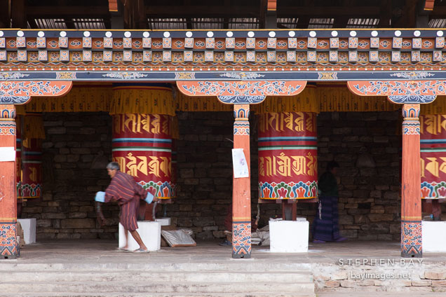 Man spinning prayer wheel. National Memorial Chorten, Thimphu, Bhutan.