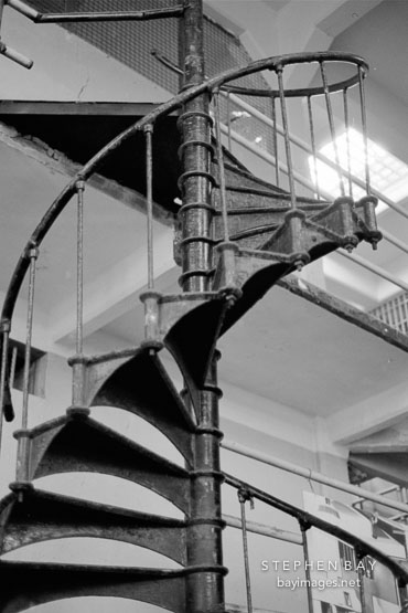 Spiral staircase in the barbershop. Alcatraz, San Francisco, California.