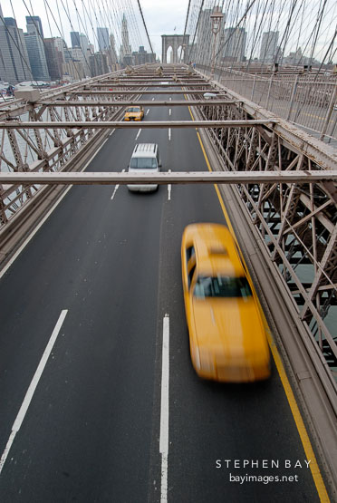 Taxi cab crossing the Brooklyn Bridge. New York City, New York, USA.