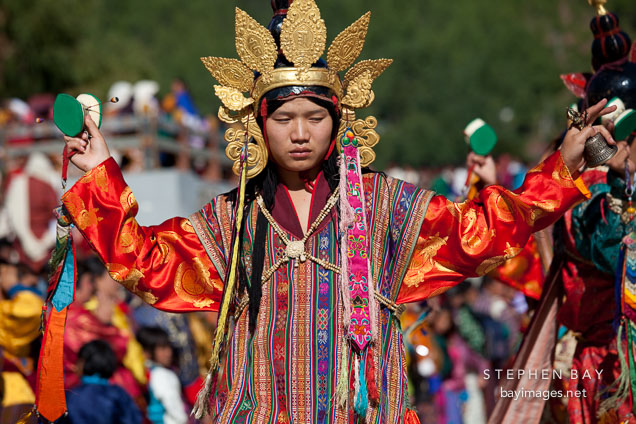 Male dancer holding drum and bell. Thimphu tsechu, Bhutan.