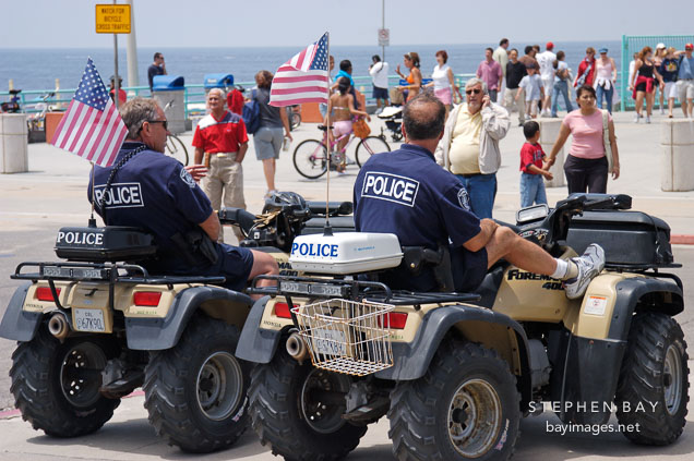 Police sitting on ATVs. Manhattan Beach, Los Angeles, California, USA.