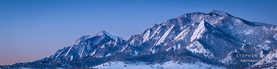 Winter panorama of the Flatirons just before sunrise. Boulder, Colorado.