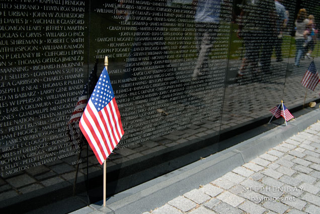Vietnam Veteran's Memorial Wall and American flag. Washington, D.C., USA.