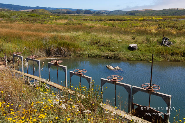 Flood control gates at Pescadero march, California, USA.