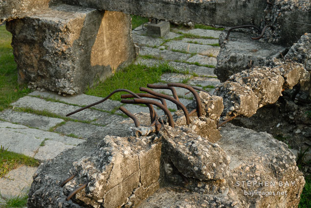 Close-up of fractured concrete and metal in the remains of the South Gate. Kowloon walled city park. Hong Kong.
