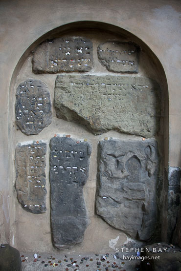 Prayer notes tucked into the wall. Old Jewish Cemtery, Prague.