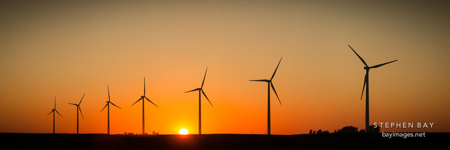 Sun setting on the Story County Wind Farm.