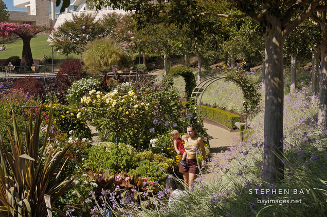 Woman and child walking through the central garden. Getty Center, Los Angeles, California.