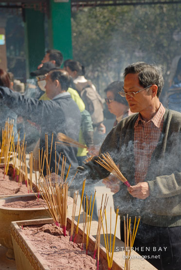 Burning incense. Wong Tai Sin Temple, Hong Kong, China.