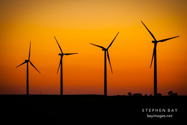 Silhouette of four wind turbines. Story County, Iowa.