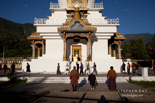 Buddhists praying and walking clockwise at the National Memorial Chorten. Thimphu, Bhutan.