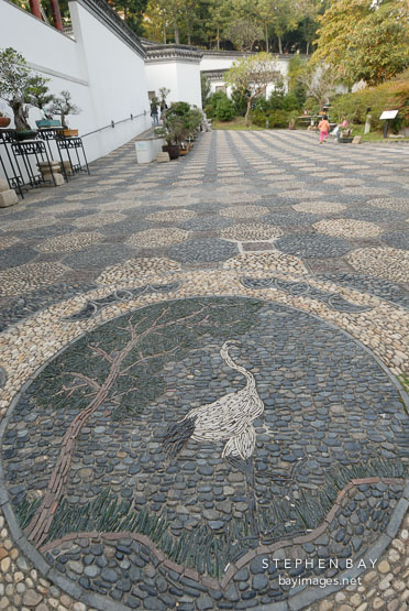 Crane and bat mosaic. Kowloon walled city park. Hong Kong.
