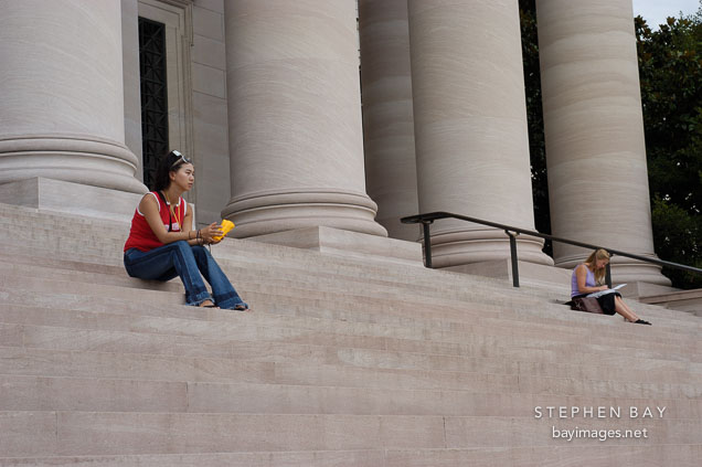 Women sitting on steps at the National Gallery of Art. Washington, D.C.