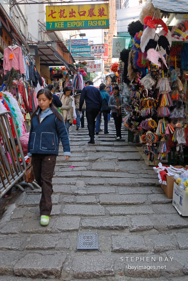 Chinese woman walks down the steps of Pottinger Street. Hong Kong