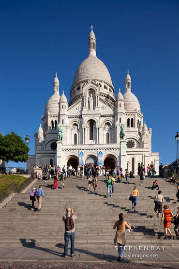 Visitors on the steps of Sacre Coeur. Paris, France.
