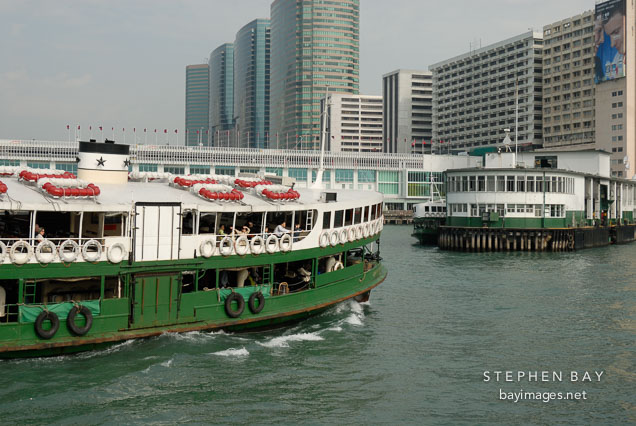 Star Ferry approaching Kowloon Pier. Hong Kong, China.