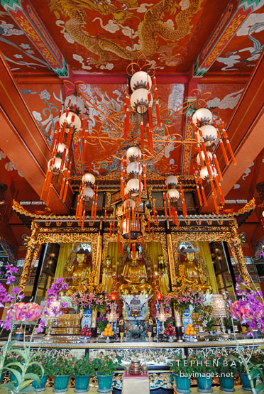 Interior of the Po Lin Monastery and three bronze Buddhas. Lantau Island, Hong Kong, Chin.