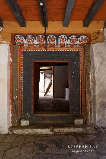 Doorway to enter Cheri Monastery with snow lion carvings. Thimphu valley, Bhutan.