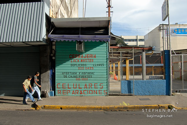 Two kids walking in San Jose, Costa Rica.
