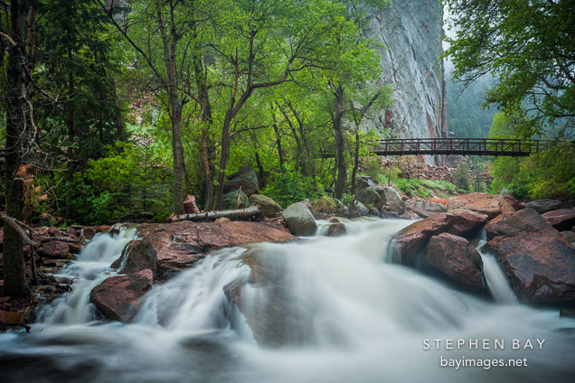 Bridge above the rushing waters of Eldorado Canyon State Park.