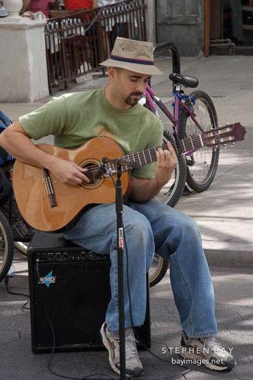Musician playing a guitar. Third street promenade, Santa Monica, California, USA.