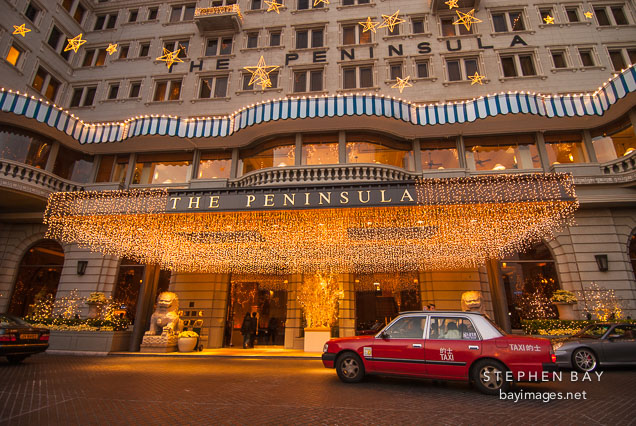 Taxi cab in front of The Peninsula Hotel. Hong Kong.