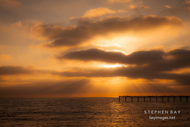Clouds and Ocean beach pier. San Diego, California.