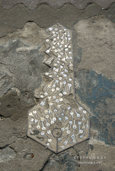 Key made of keys. Sidewalk, San Jose, Costa Rica.