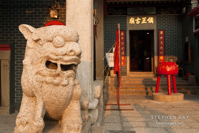 Foo dog statue guarding the Hau Wong Temple. New Kowloon, Hong Kong, China.