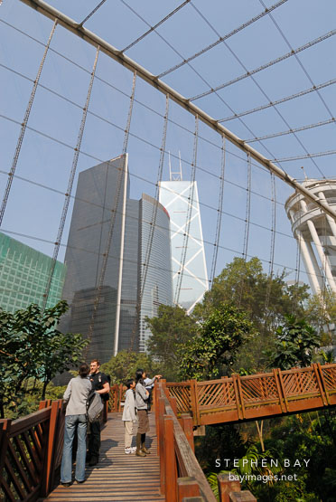 Tourists on the walkway of the Edward Youde Aviary. Hong Kong, China.