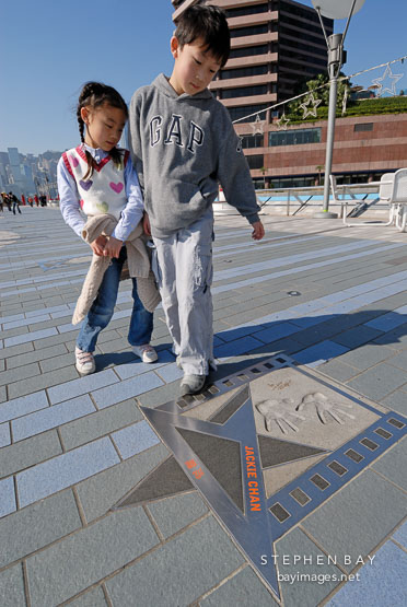 Two children at the Avenue of Stars. Hong Kong, China.