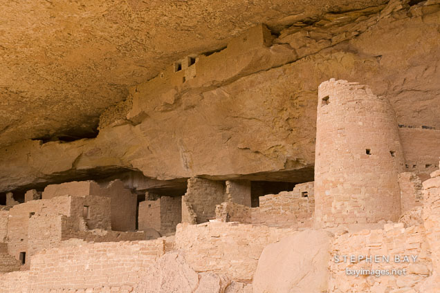 Rounded tower and storage rooms near alcove ceiling. Cliff Palace, Mesa Verde, Colorado.