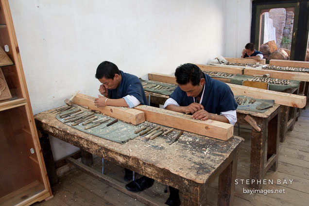 Students working in a wood carving classroom. National Institute for Zorig Chusum, Thimphu, Bhutan.