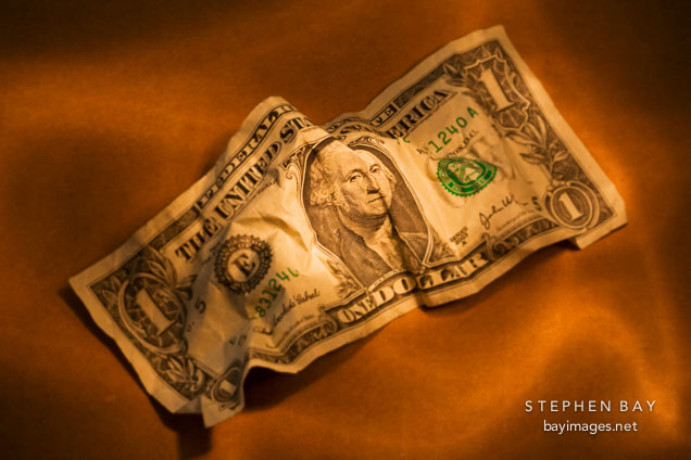 Crumpled dollar bill.