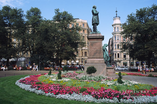 Statue of J. L. Runeberg (1804-1877). National poet and author of the national anthem. Sculpture by son Walter Runeberg (1885). Female figure is the patron muse of Finnish poetry. Runebergin esplanadi, Helsinki, Finland.