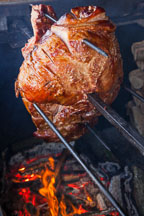 Roasting pork over wood fire. - Photo #30213