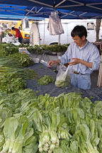Man selling Asian vegetables at the Farmer's market. Santa Monica, California. - Photo #3314